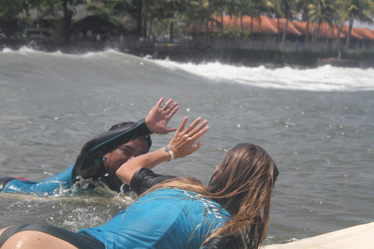 Surfers And Medewi *