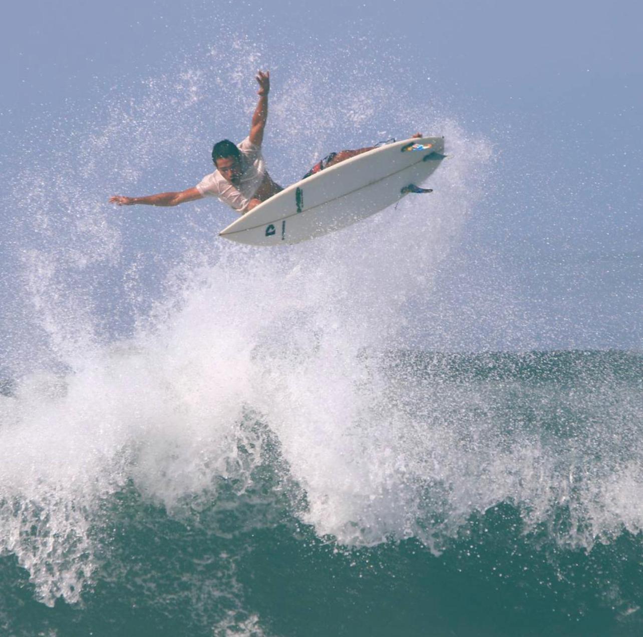 Surfers And Medewi *